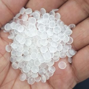 PP resin, which comes in the form of small beads or pellets, is fed into an extruder machine.